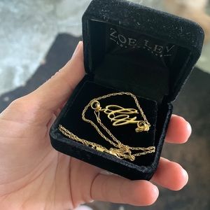 Solid 18k gold custom made nCj necklace.